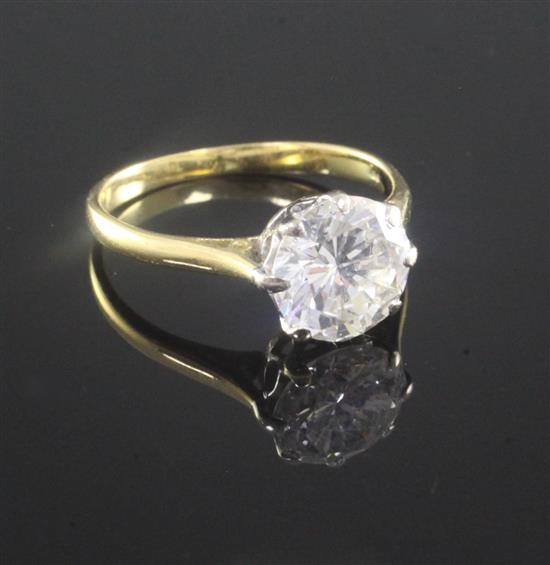 An 18ct gold and solitaire diamond ring, size R.